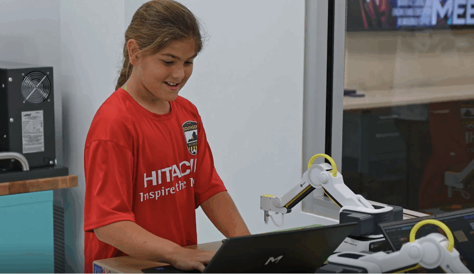 A young girl using a laptop